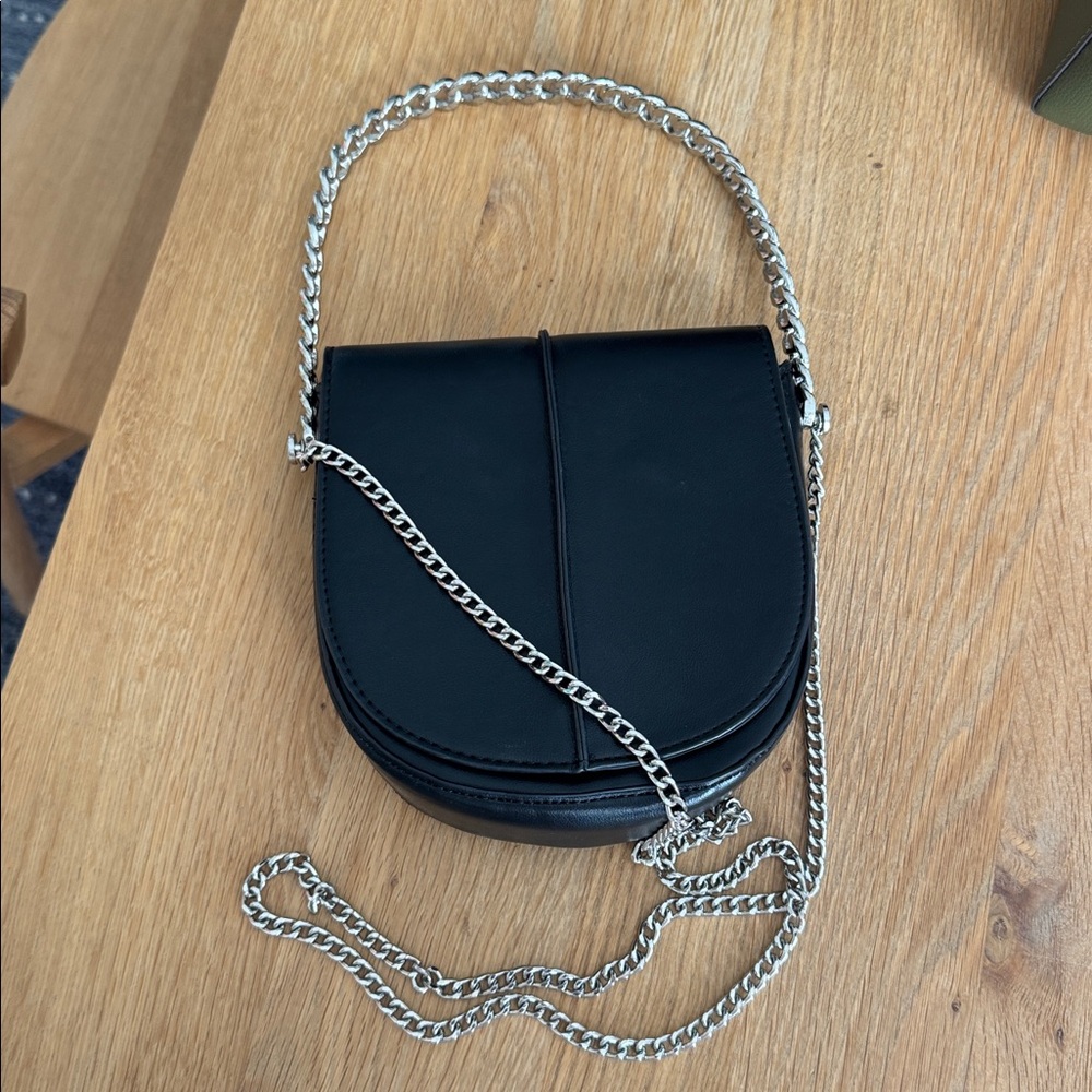Melie Bianco Sleek Black Crossbody Bag with Silver Chain